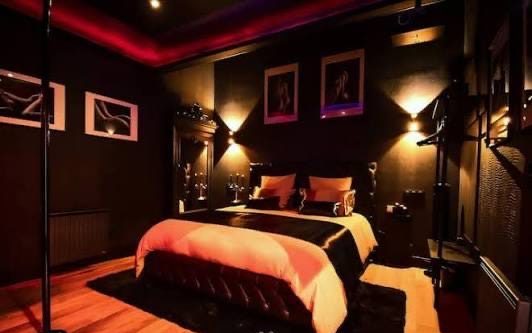 Dark suite with pole and mood lighting