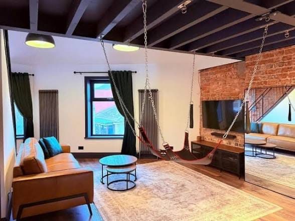 Brick loft with a hanging sling